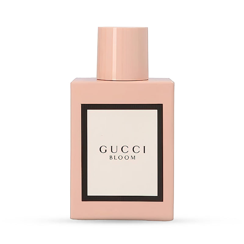 Gucci Bloom perfume bottle with a soft pink design and minimalist label.