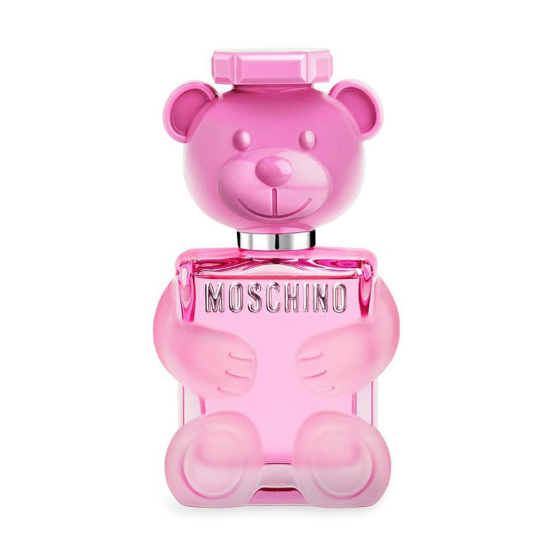 Pink teddy bear-shaped Moschino perfume bottle with whimsical design.