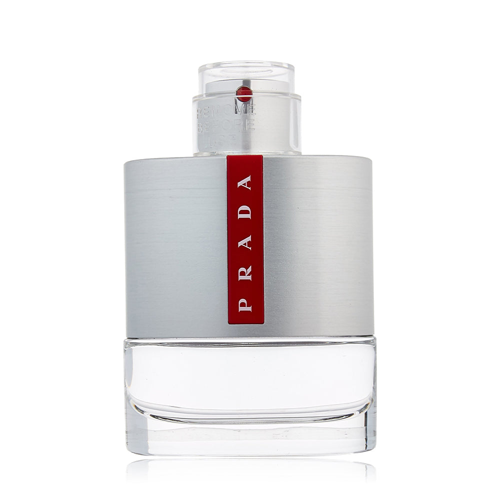 Prada cologne bottle with silver and red design on white background.