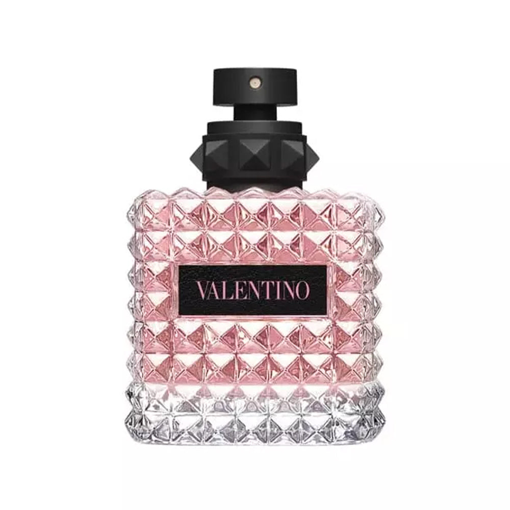 Valentino perfume bottle with pink liquid and studded design.
