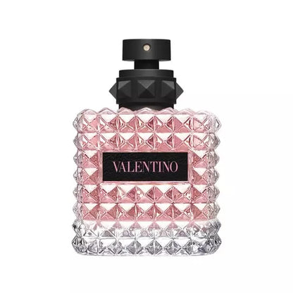 Valentino perfume bottle with pink liquid and studded design.