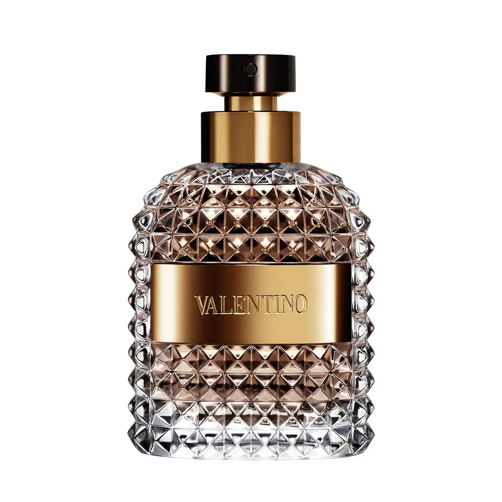 luxury perfume bottle with gold label and decorative glass design