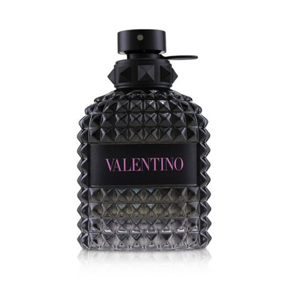 Luxurious Valentino perfume bottle with black studded design and pink lettering.