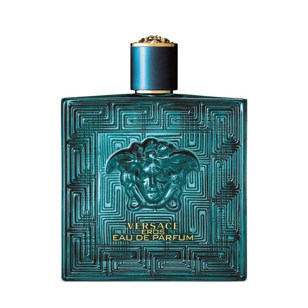 Teal luxury perfume bottle with intricate design and gold accents on cap.