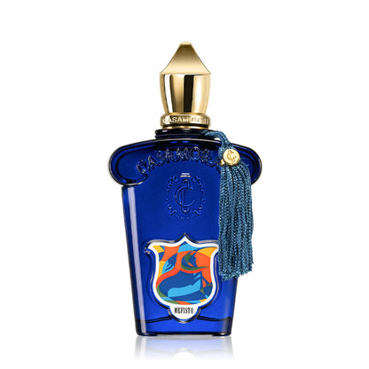 Elegant blue perfume bottle with gold cap and decorative crest design.
